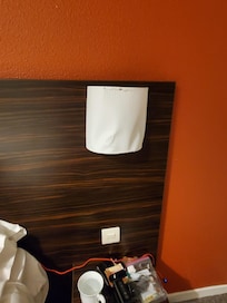 Cheap damaged sconces by the bed
