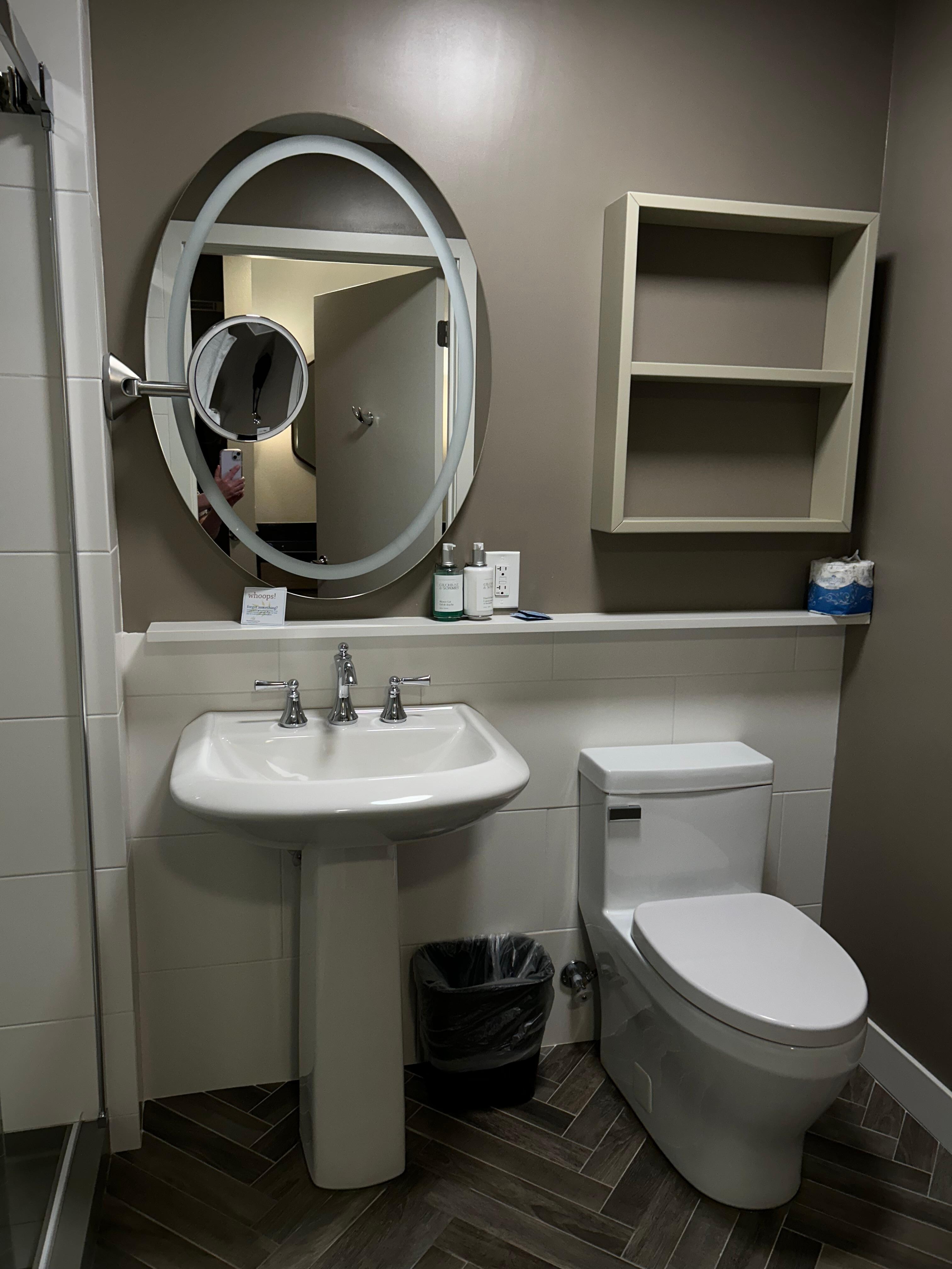 Narrow shelves and no counter space in bathroom. 