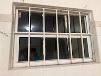 Bathroom window overlooking construction site