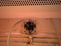 Uncovered 230-V socket