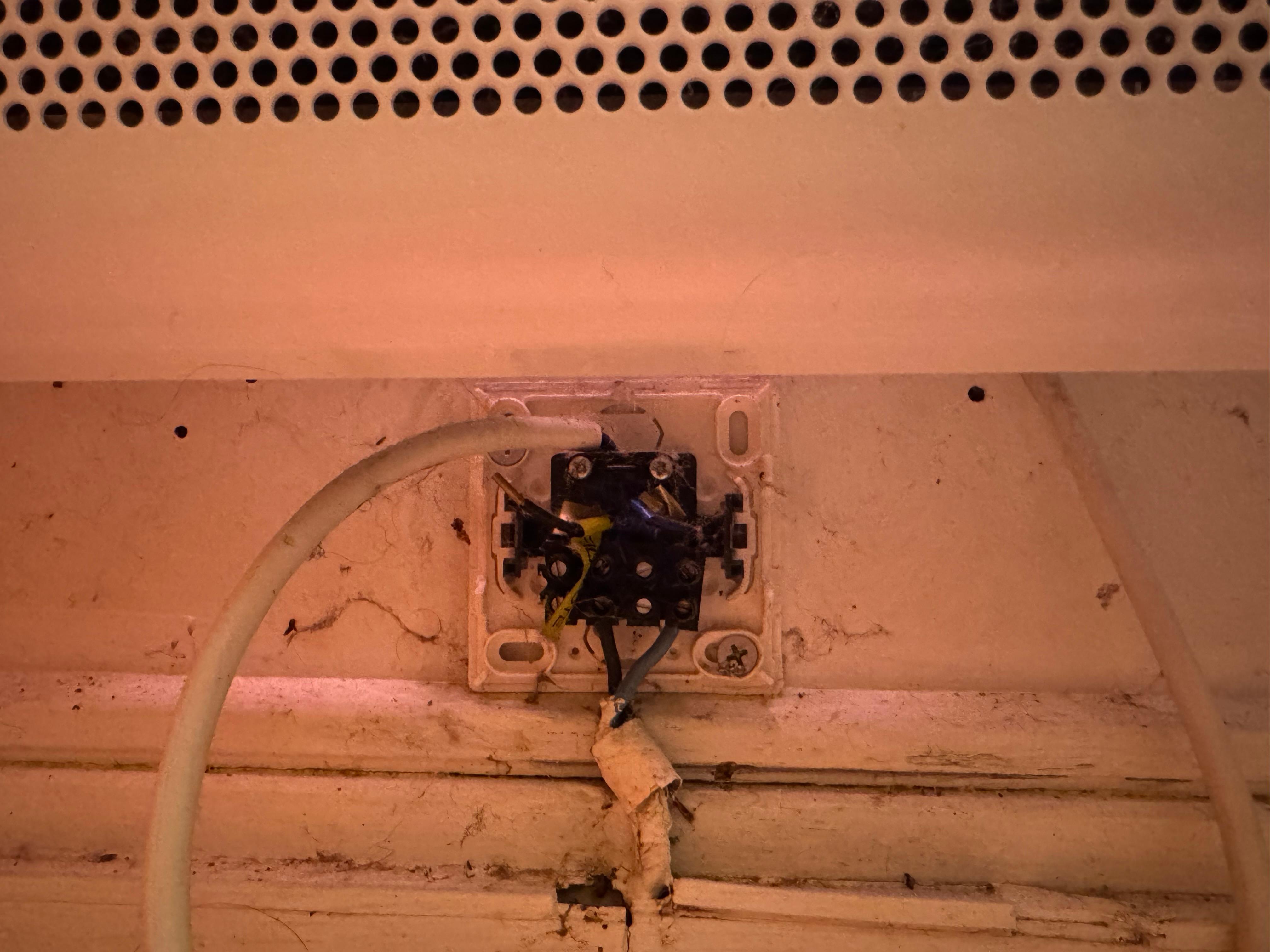 Uncovered 230-V socket