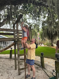 Playing on the treehouse.