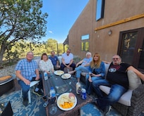The whole family enjoying conversation and the country atmosphere.
