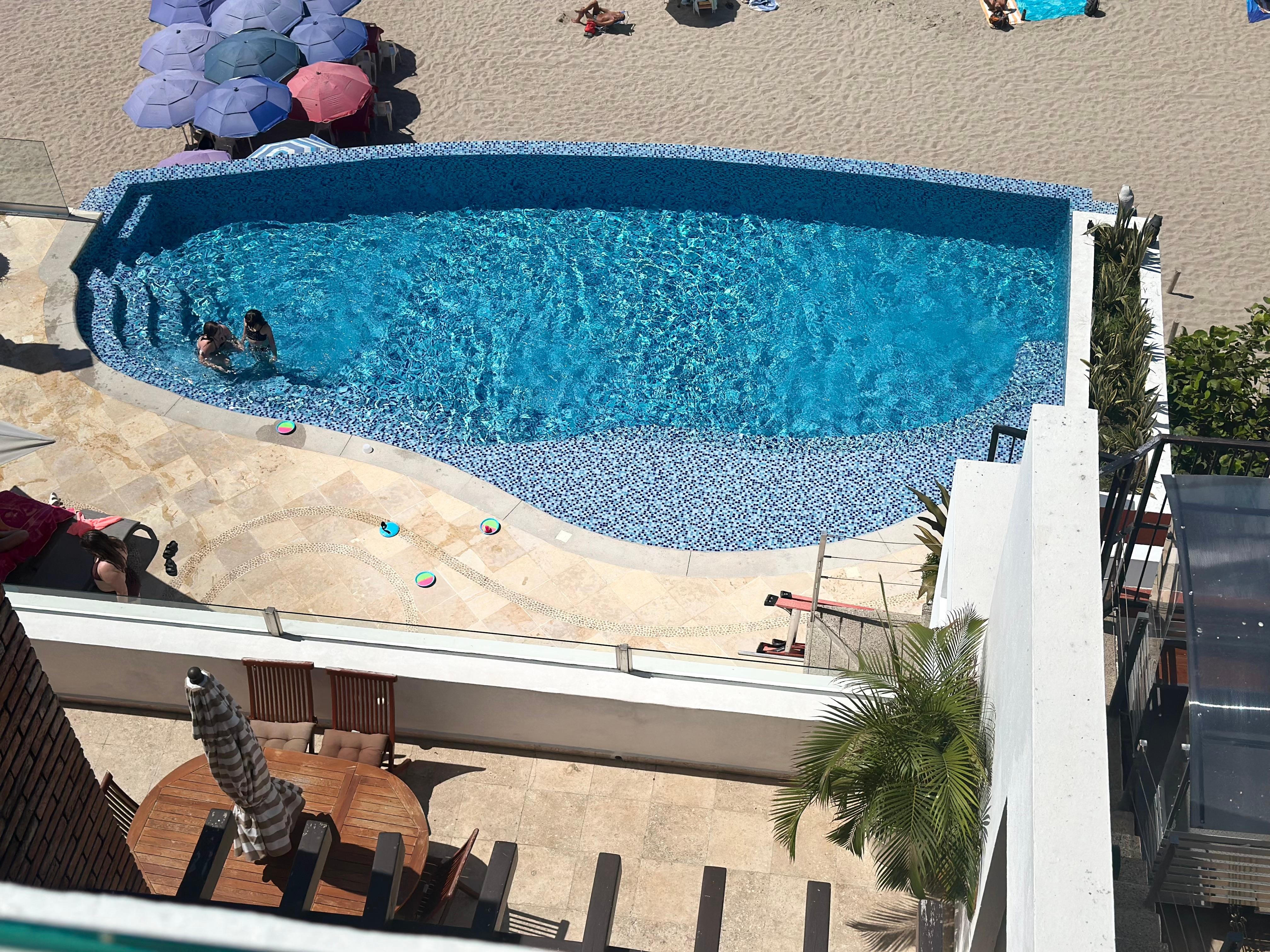 View from condo balcony to pool.