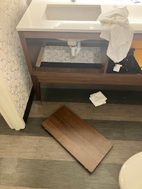 The panel that fell off directly onto my child’s foot while he was washing his hands.