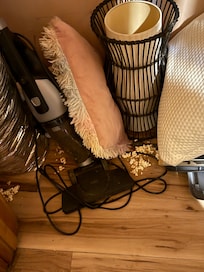 Bunch of junk in one of the closets, including popcorn all over the floor