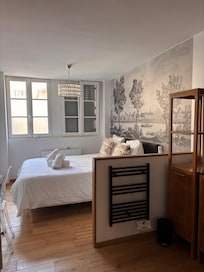 The bedroom (shower is not in the photo, but just to the right, as well as a sink)