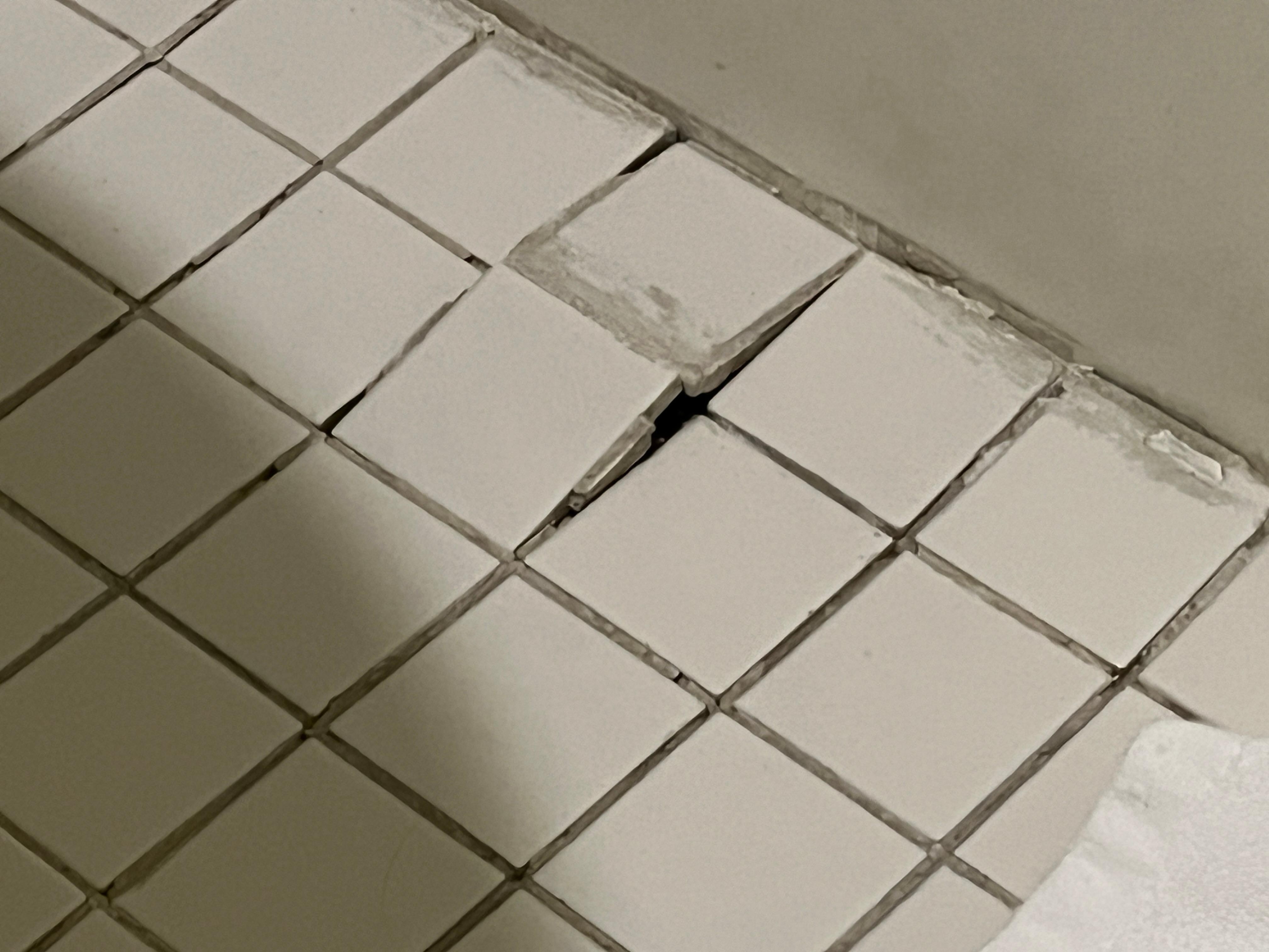 Buckled tiles in the bathroom