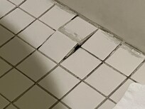 Buckled tiles in the bathroom