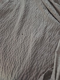 Cigarette burn holes in cover and blanket