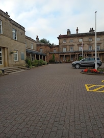 The spa, gym and pool building to the left of the hotel on this picture.