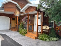 Front door and sign with host phone #