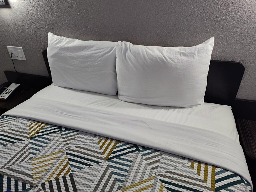 Stain on the bed sheet.