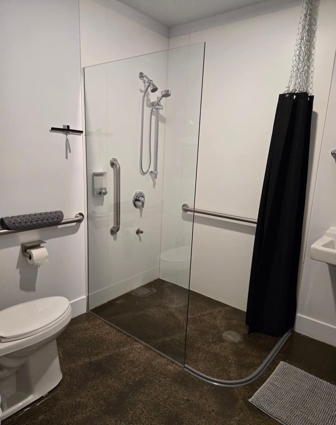 Lovely bath, just needs a shelf or table for toiletries. If you're short,( I am), the shower heads couldn't be reached to adjust. Hot water takes a few of minutes too.