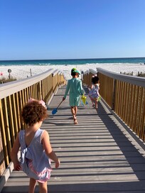 Quick walk to beach with bathrooms easily available and hose/shower to rinse off