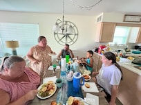 Enjoying grilled Grouper, Shrimp and Crab Cakes bought fresh from Billy’s Seafood store