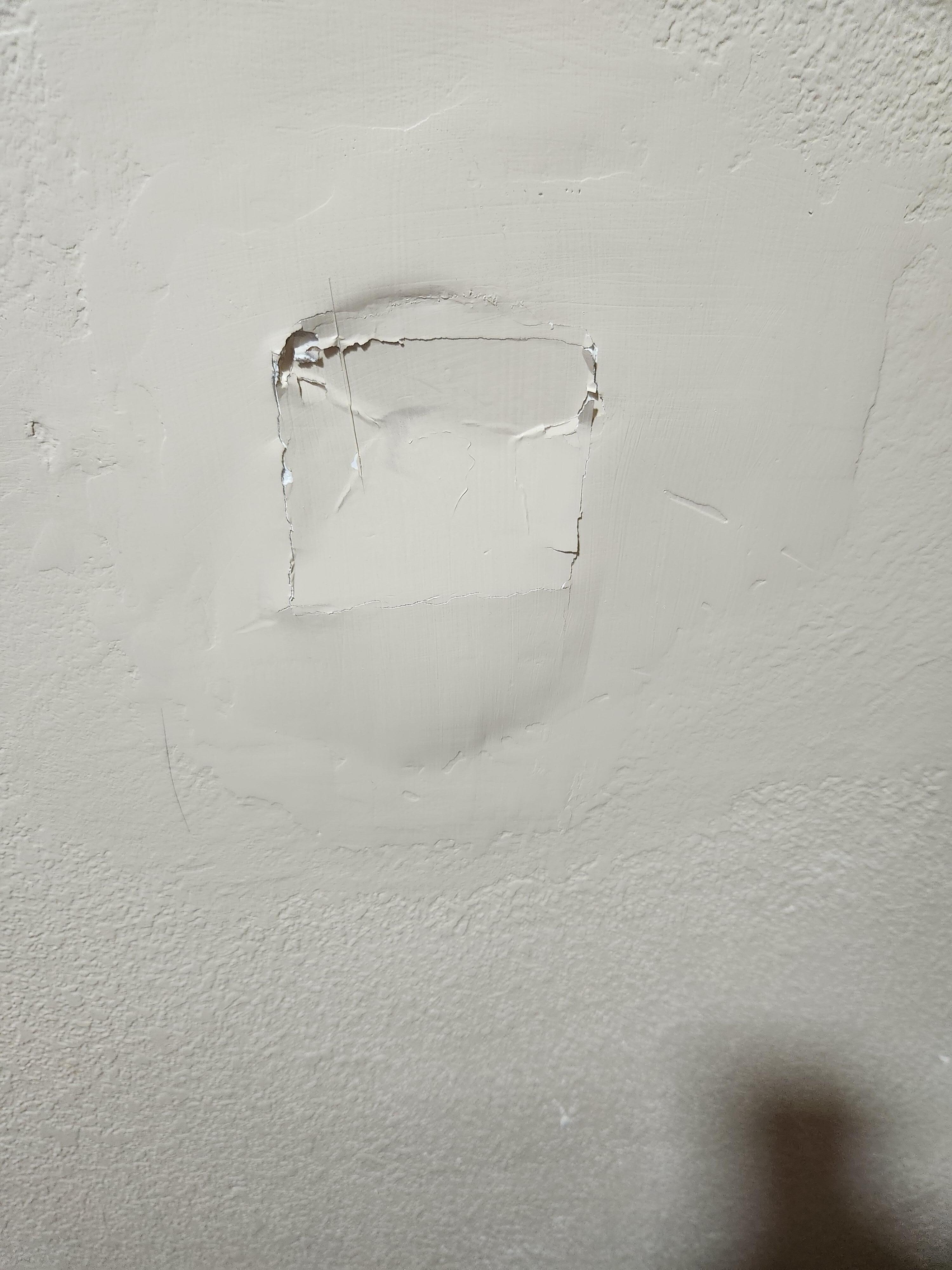 In wall behind door to hallway.