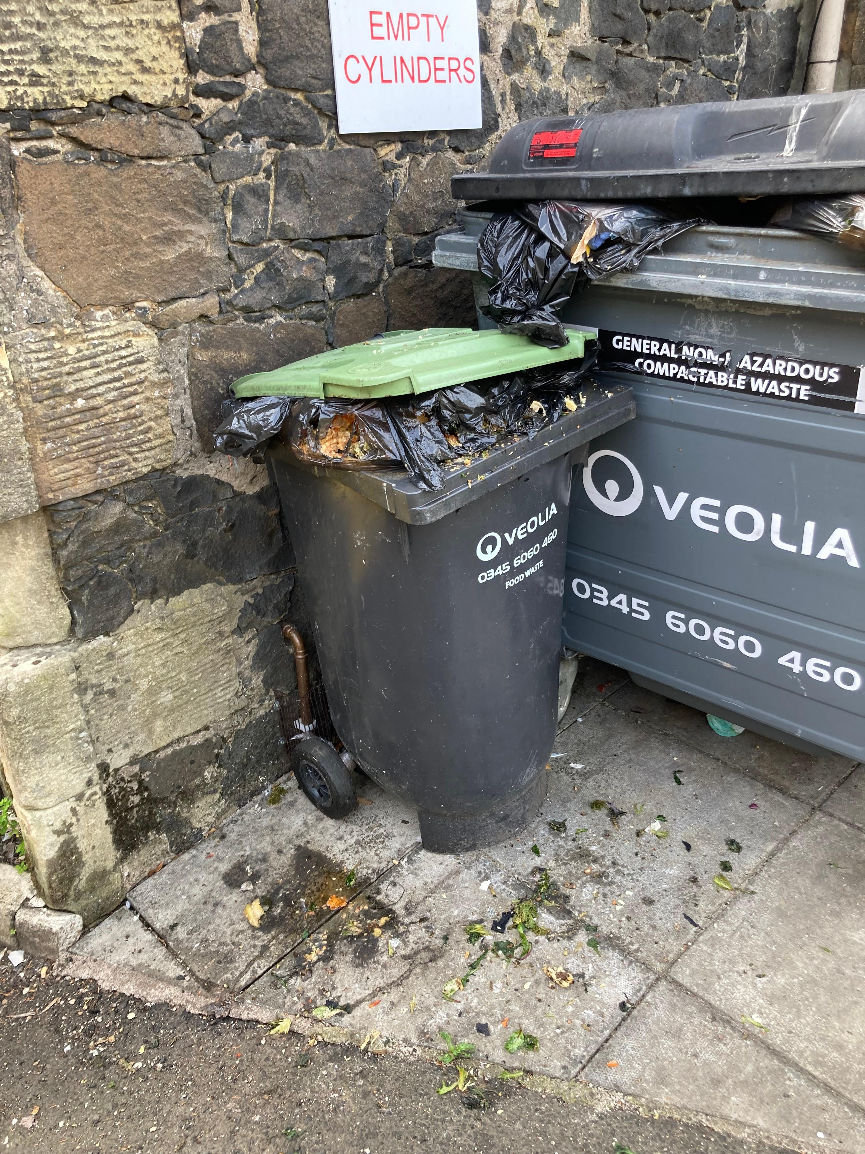 Garbage container by kitchen 
