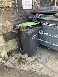 Garbage container by kitchen