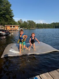 Large foam pad provided for kids to play on water