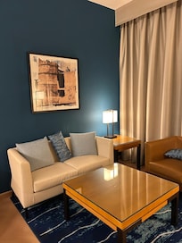 Big spacious bedroom with comfortable furniture.