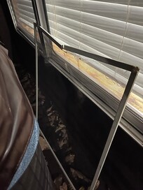 Broken window piece left outside by tub