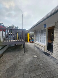 Door to our room - Unit 15, the tubs, and stairs to pool.