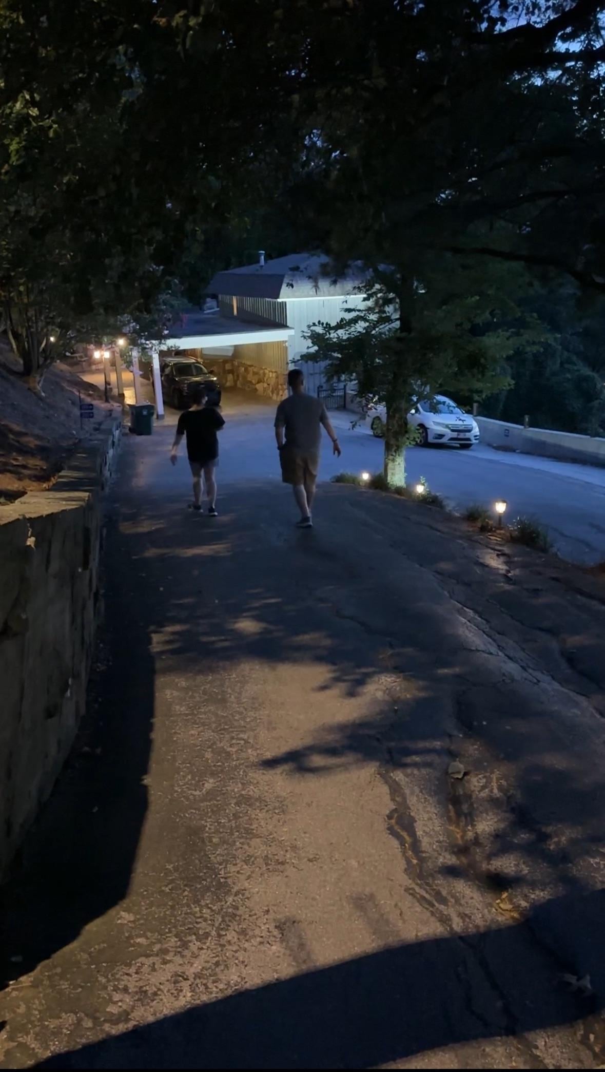 Walking down the driveway.