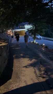 Walking down the driveway.