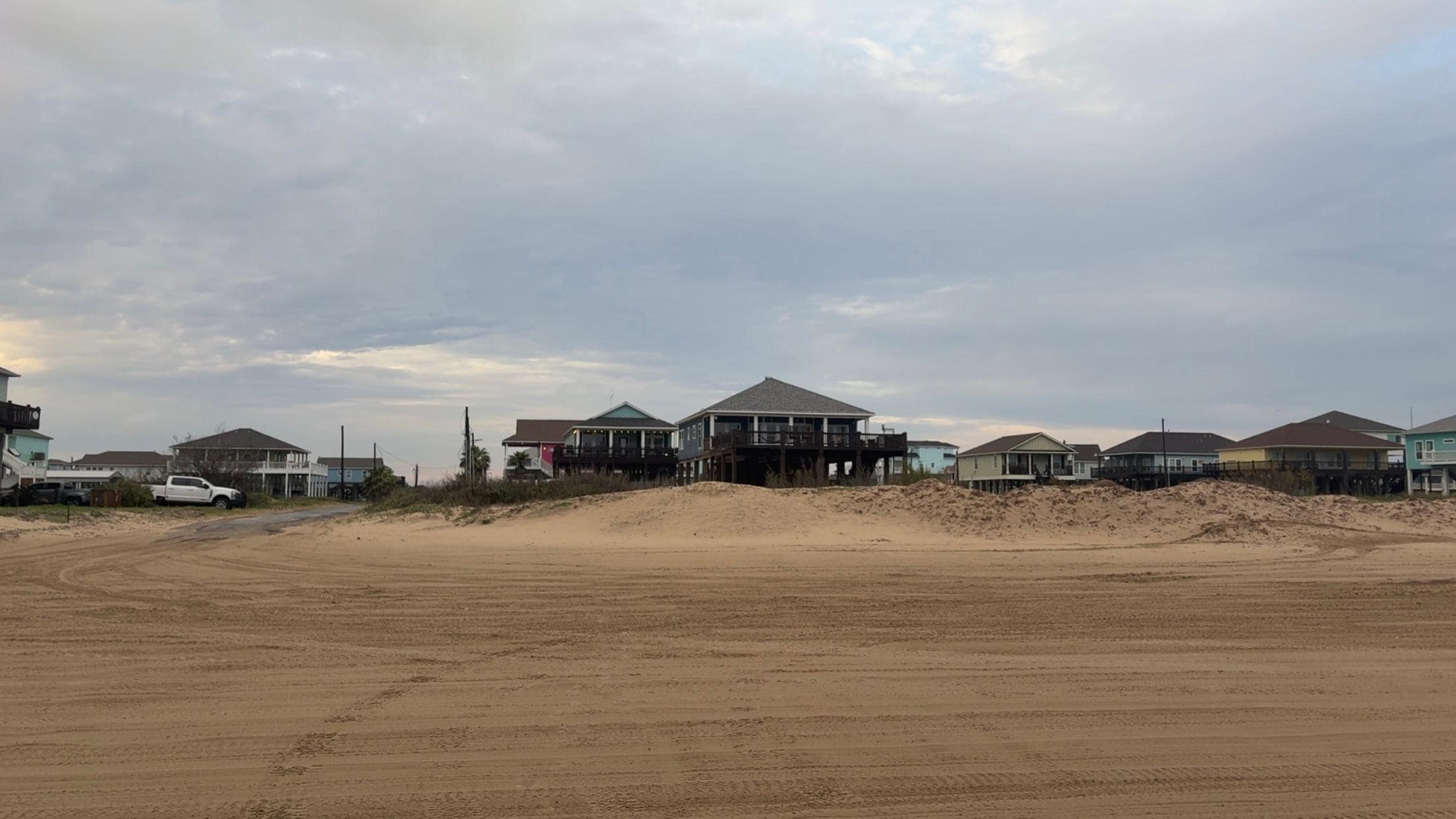 Big blue house in the middle. 