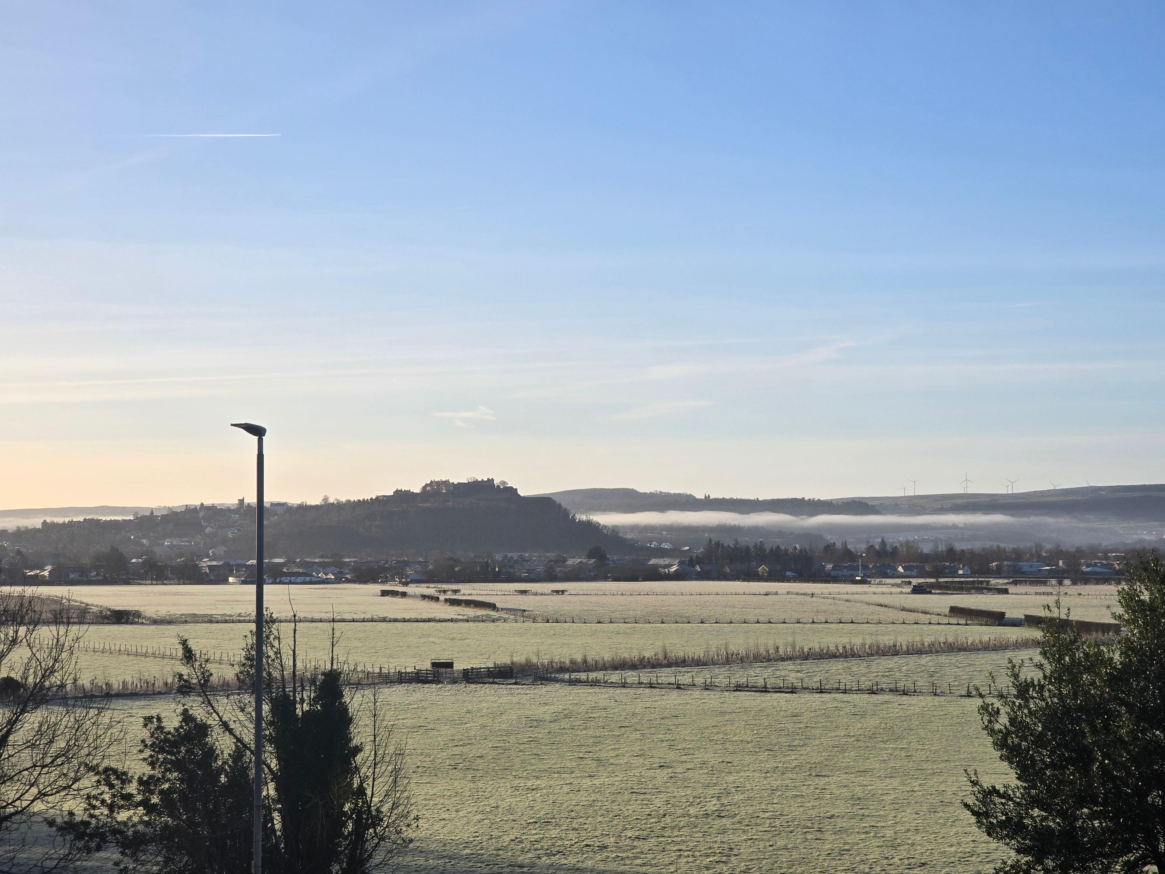 A room with a view on a bright morning with low lying mist. 