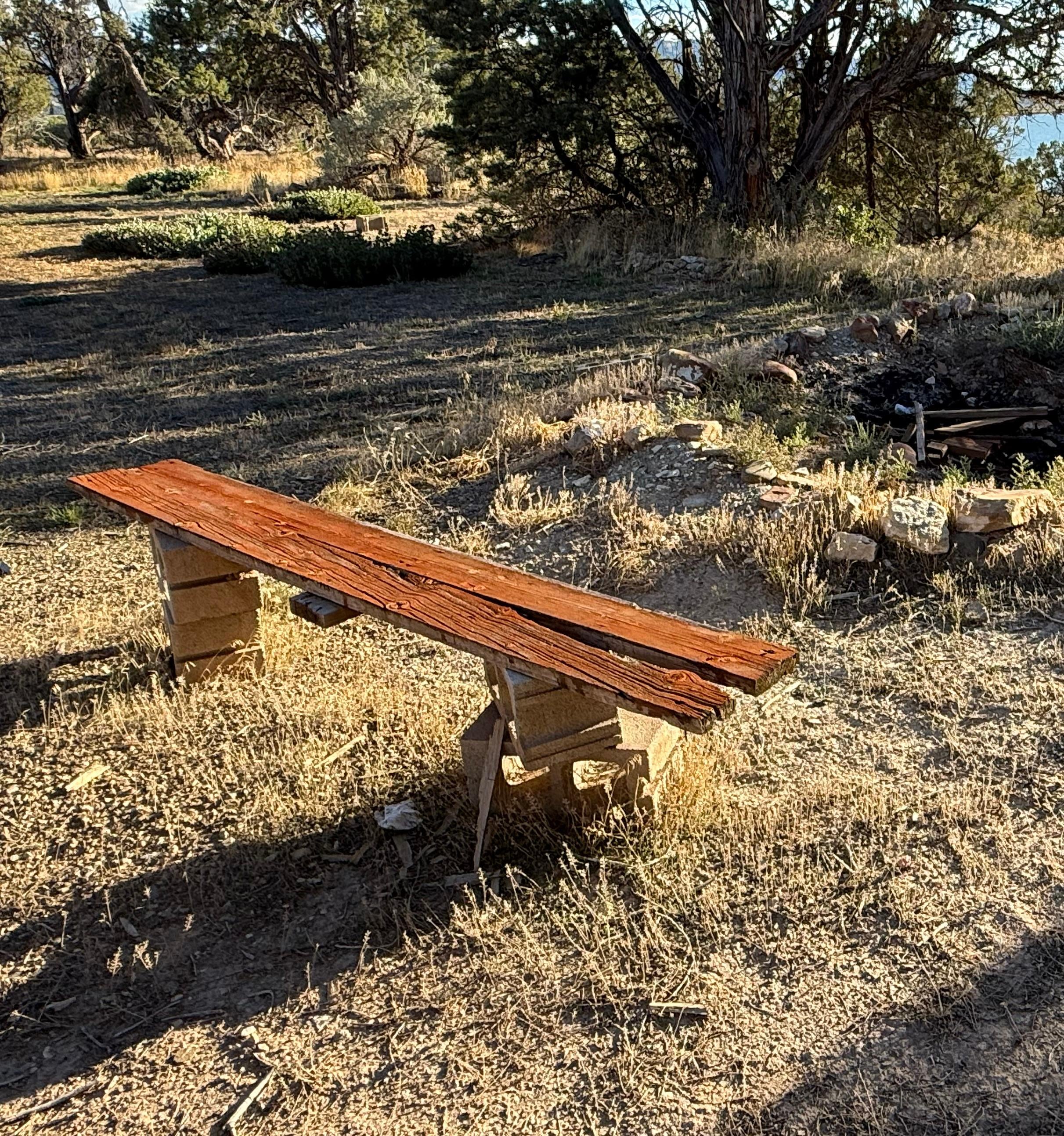 Makeshift bench with cinder blocks. PM said they will “secure” the board for future guests!