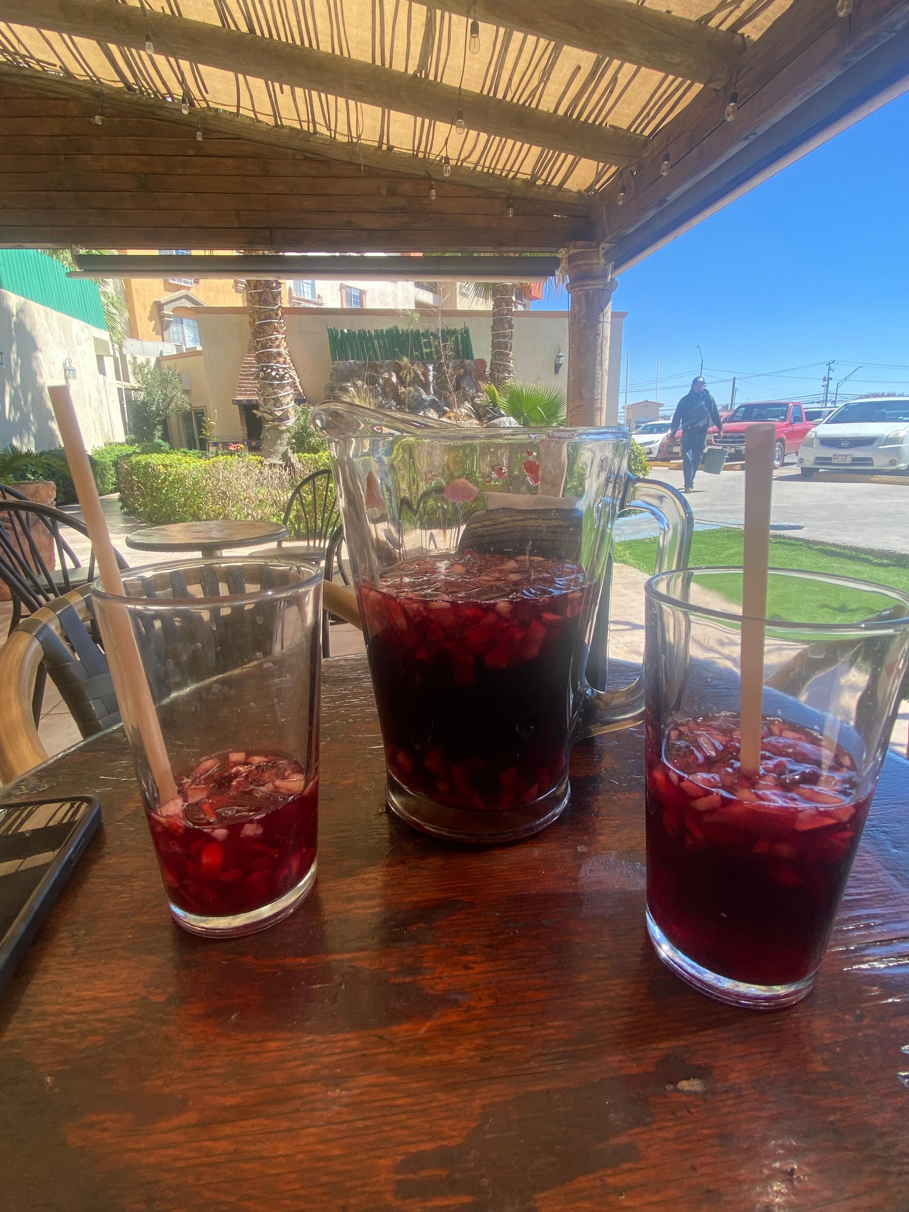 Sitting & relaxing while having drinks which was delicious. Wine with fruit 