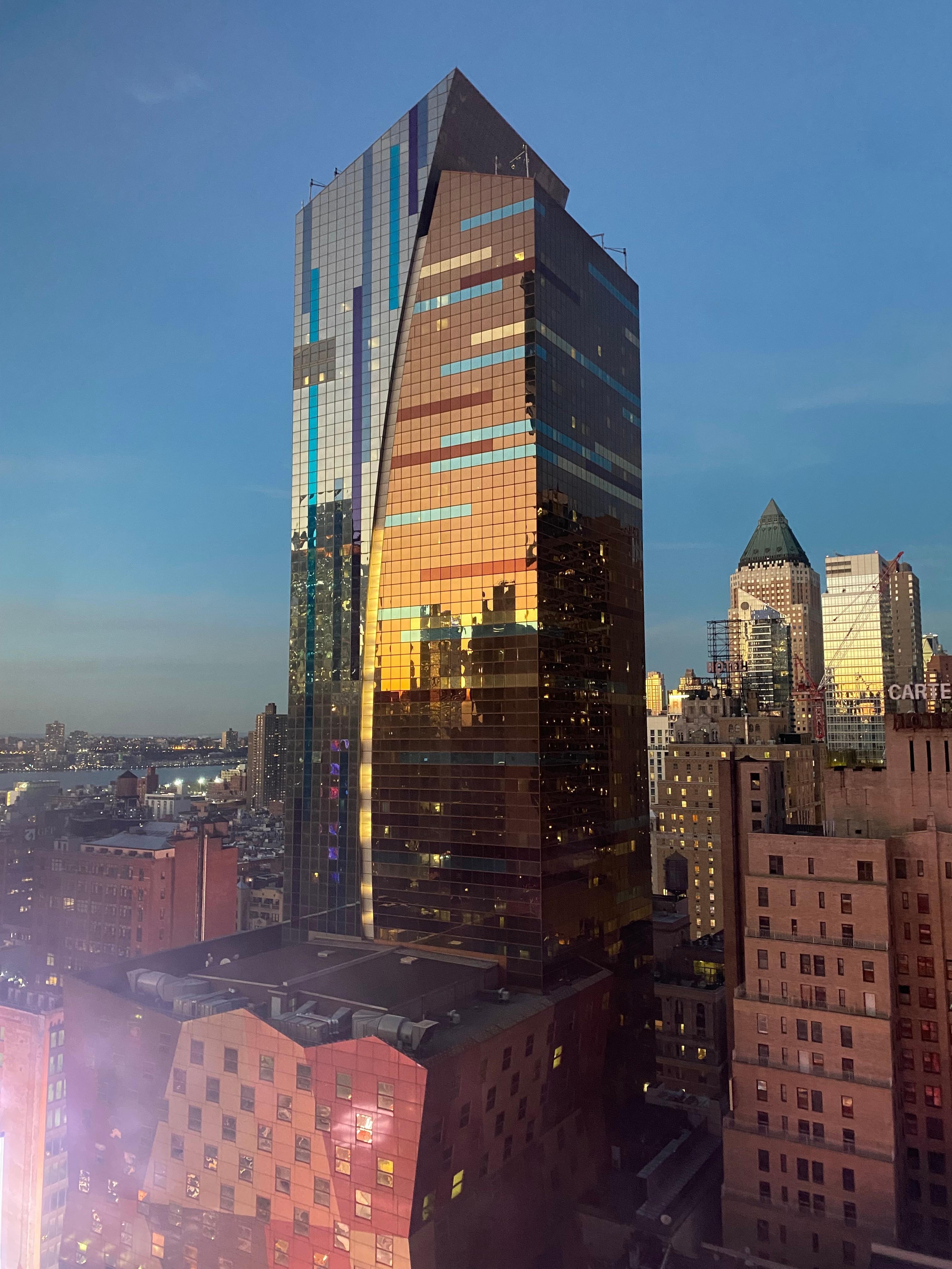 Sunset on building next to the hotel.