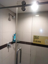 Spotless shower cubicle in glass shower stall. Pic taken after it was used but the condition speaks for itself. No grime, stains, hair etc anywhere in the bathroom and sink areas