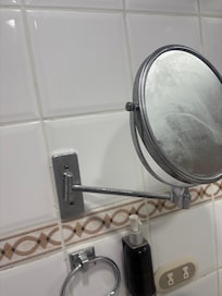 Loose mirror in the bathroom