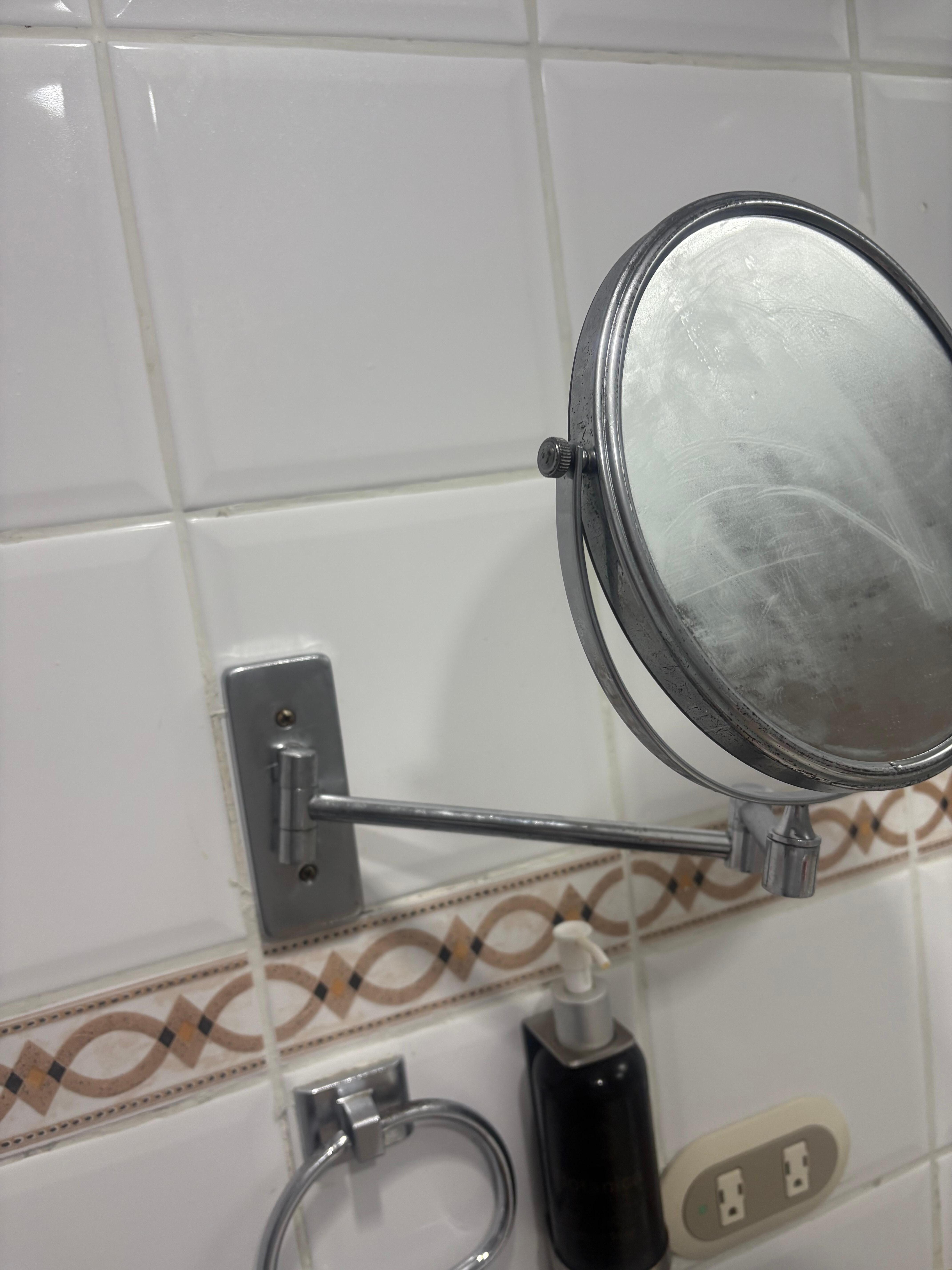 Loose mirror in the bathroom 