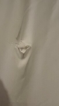 Hole in fitted sheet