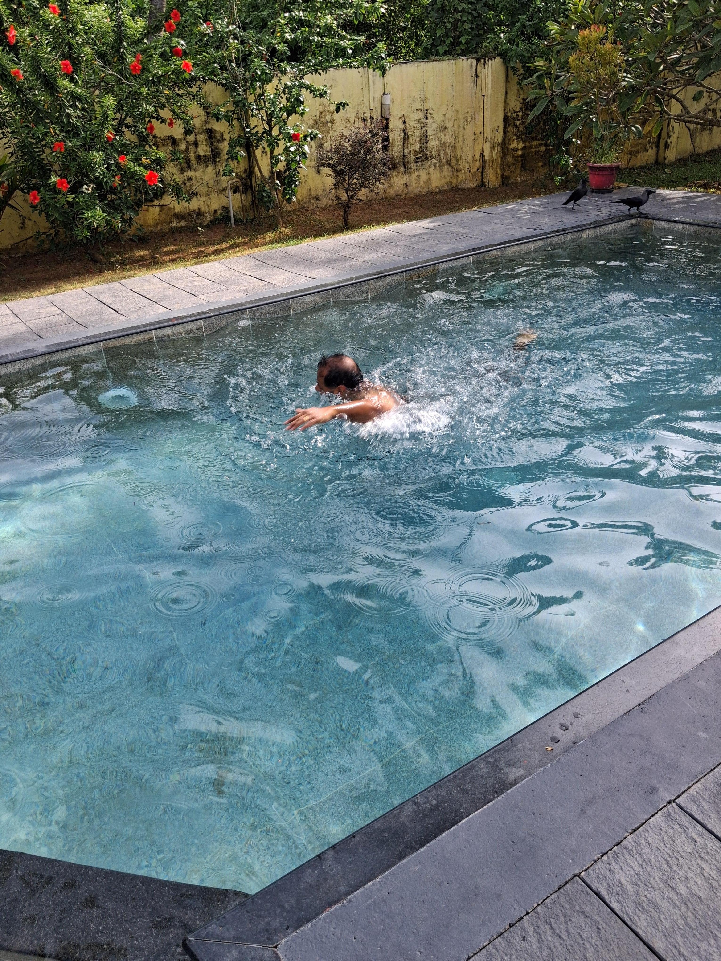 Solo swimmer, face obscured on purpose. 