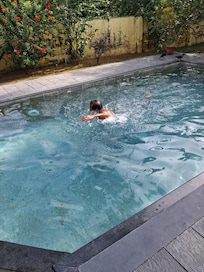 Solo swimmer, face obscured on purpose.