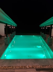 Evening its lights in the pool make it cozy, it changes colors. Its also nice.