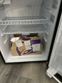 Someone named ashely left this in a broken refrigerator in the room