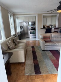 Looking into the living room toward kitchen from the deck