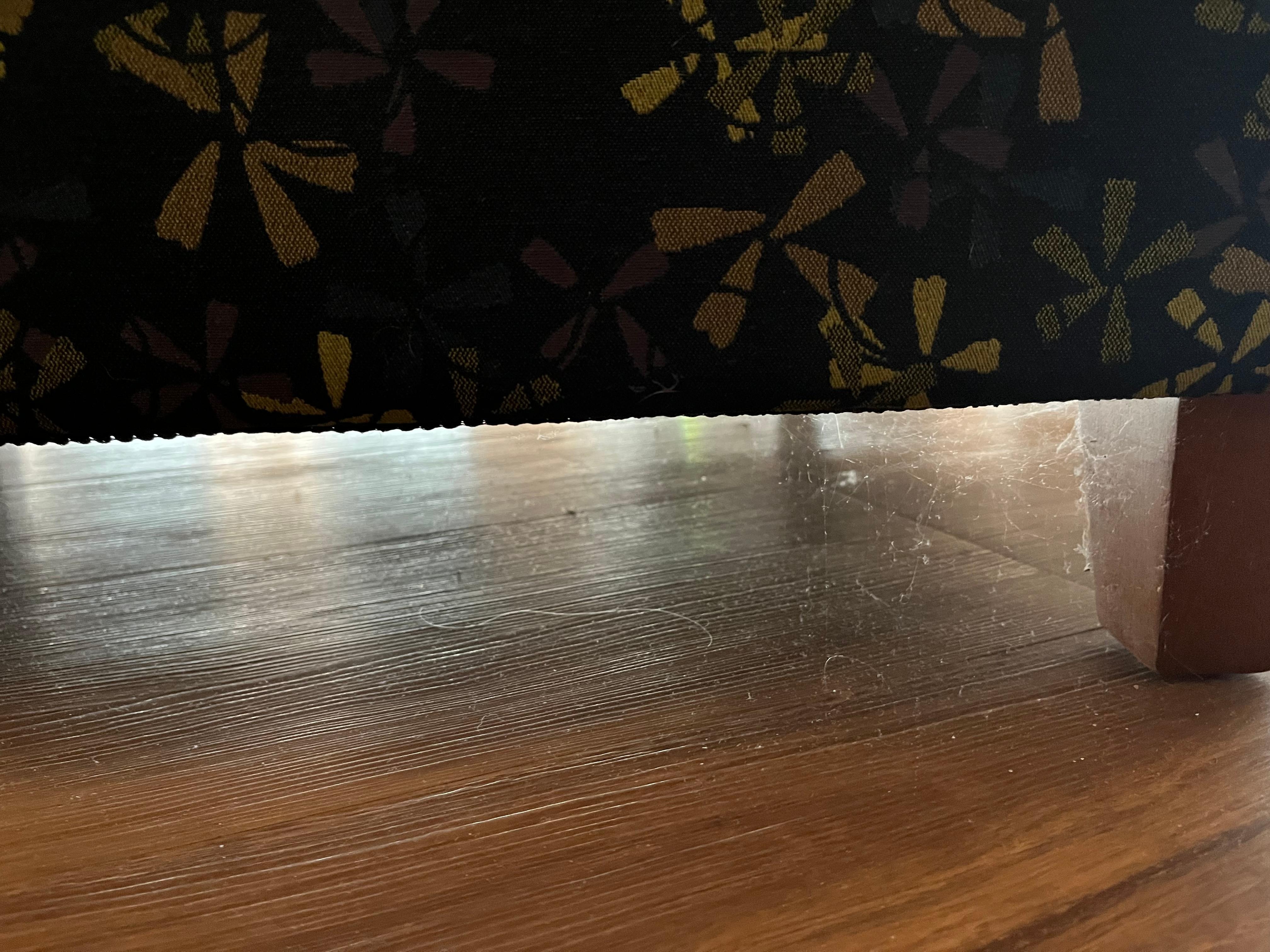 Dust and cobwebs under a chair