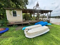 The boats were not stored properly—instead of being on the dock, they were flipped over in the grass, extremely dirty, and obviously neglected.