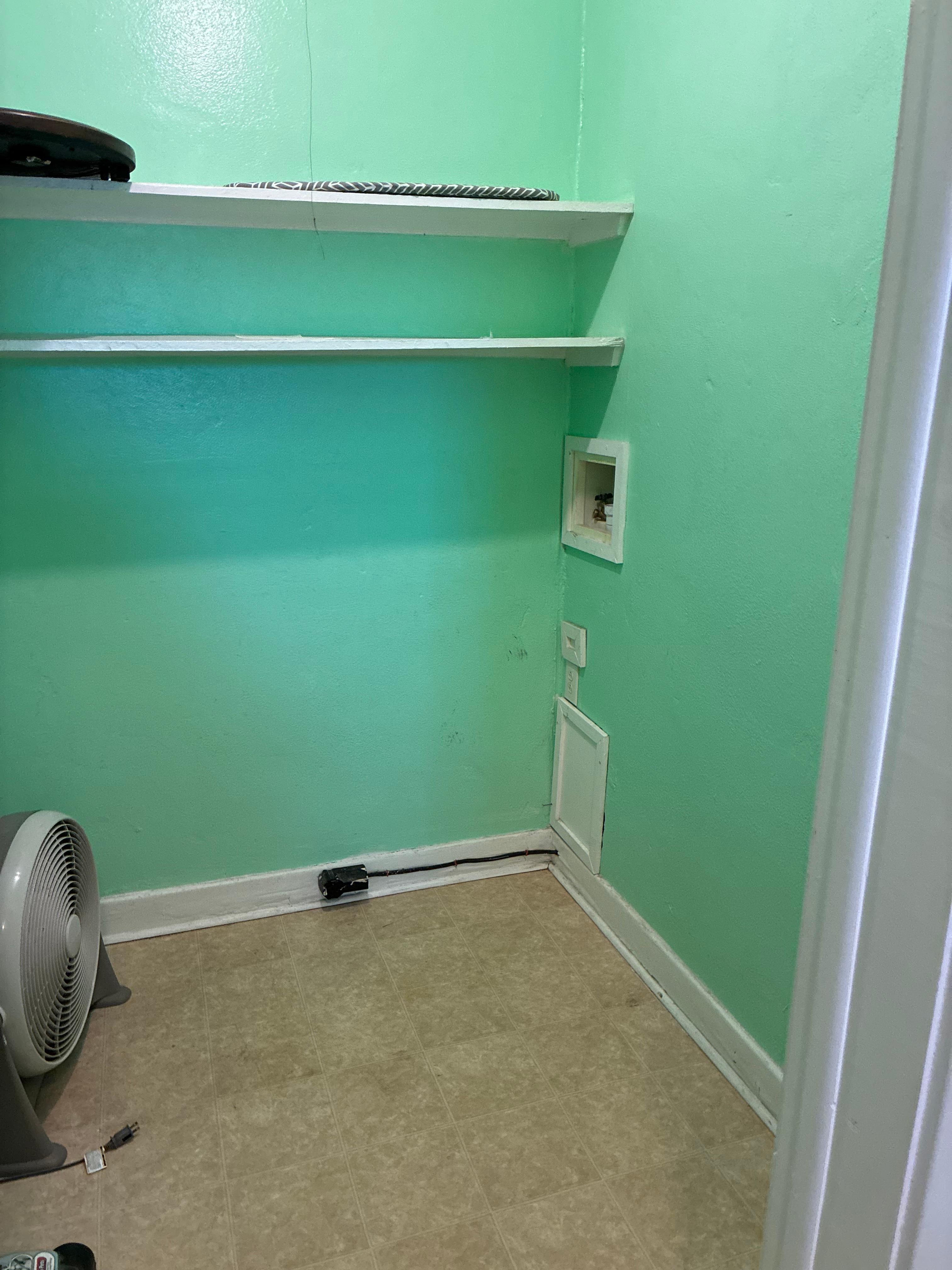 Missing washer/dryer and doors off hinges.  Fan with filth attached.