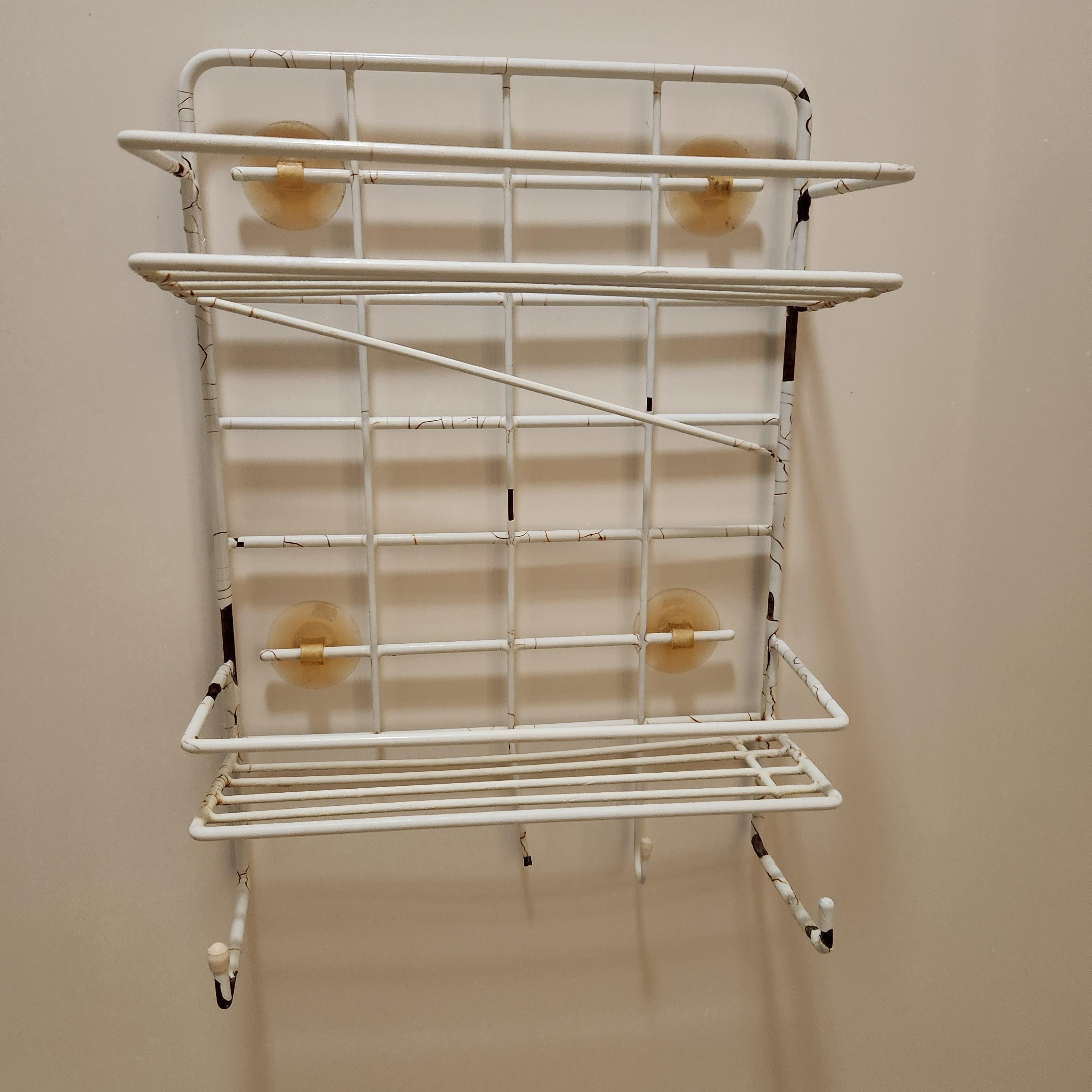 Rusted and broken shower caddy