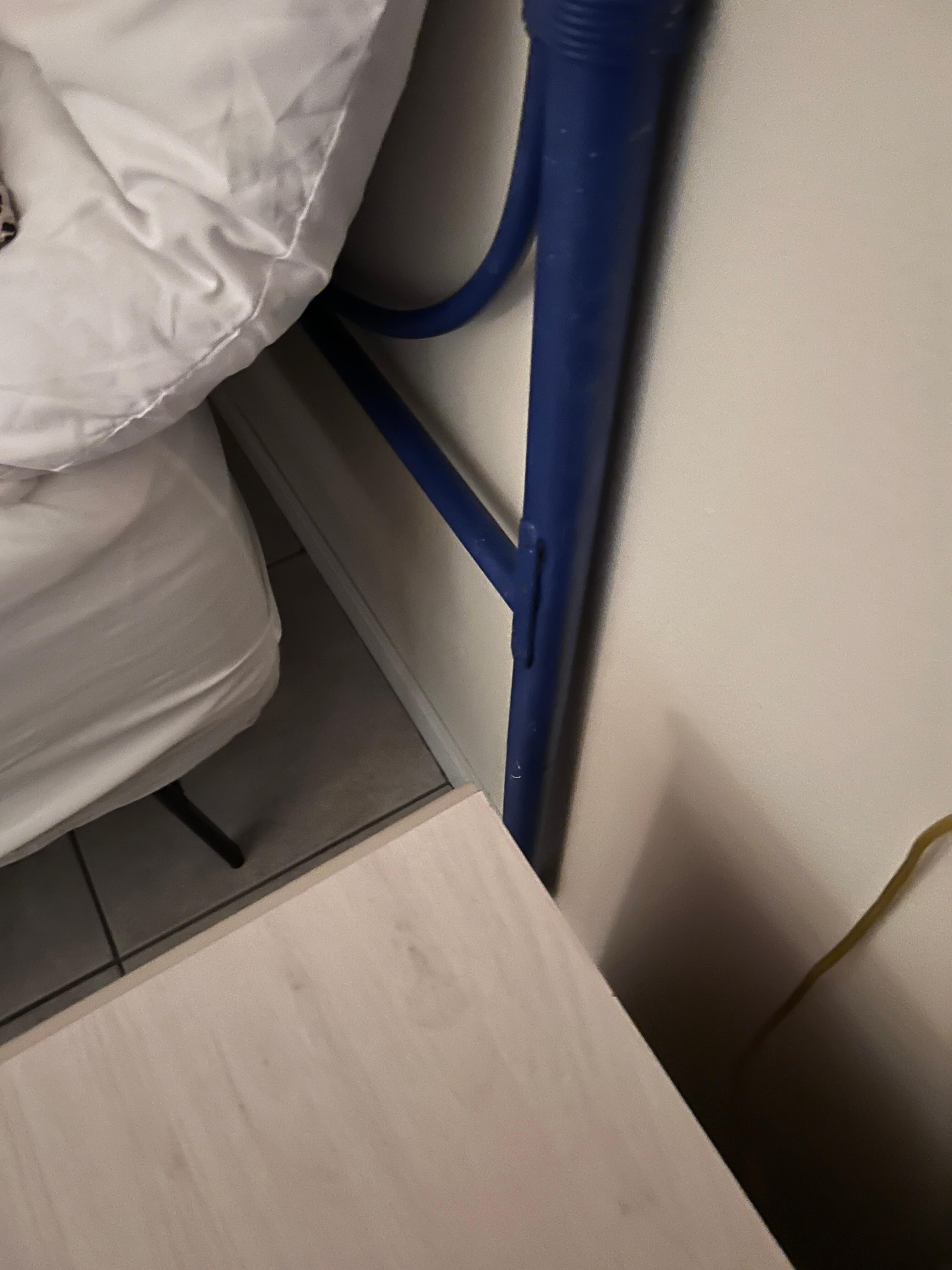 Bed frame not attached to headboard. 
