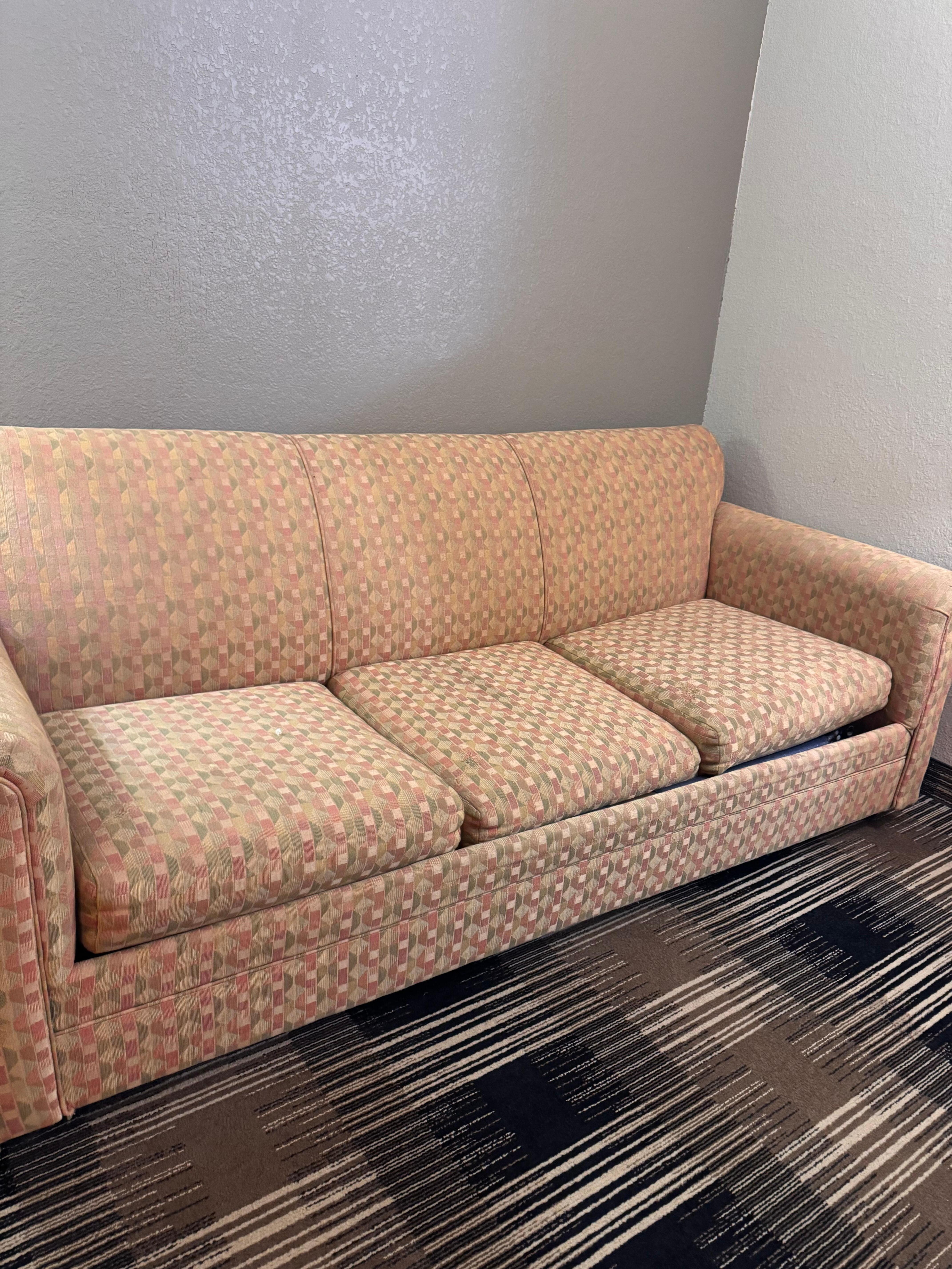 Couch in room.. couches also stacked up in hallways 