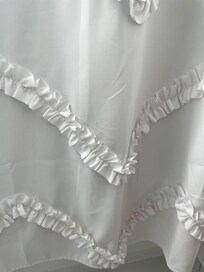 Hair in shower curtain.